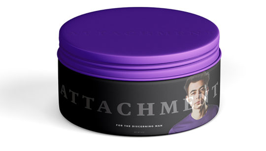 A small jar of pomade called "ATTACHMENT." Call of Duty player Dillon "Attach" Price is featured on the label.